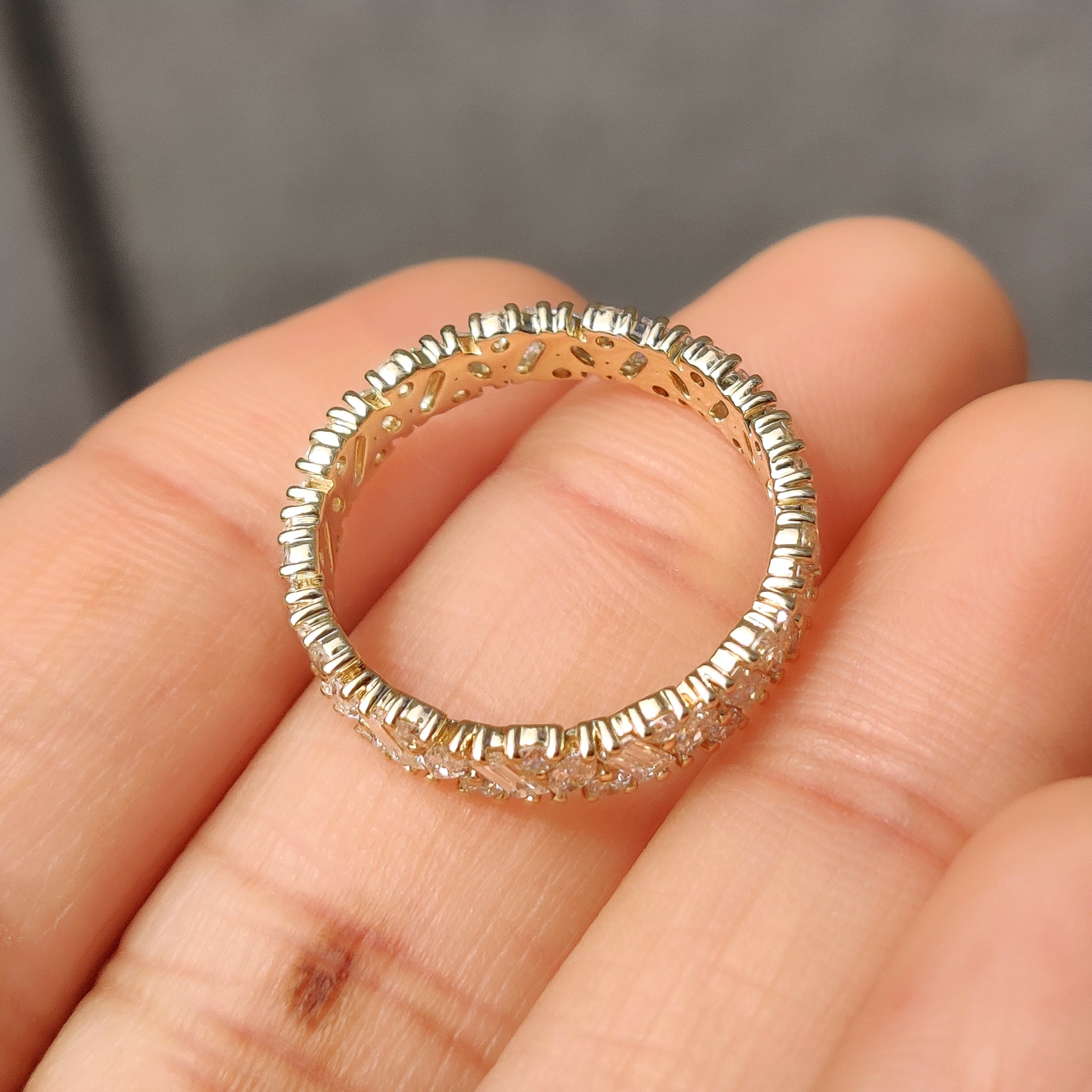 Elegant eternity band with multi shape lab grown diamonds.
