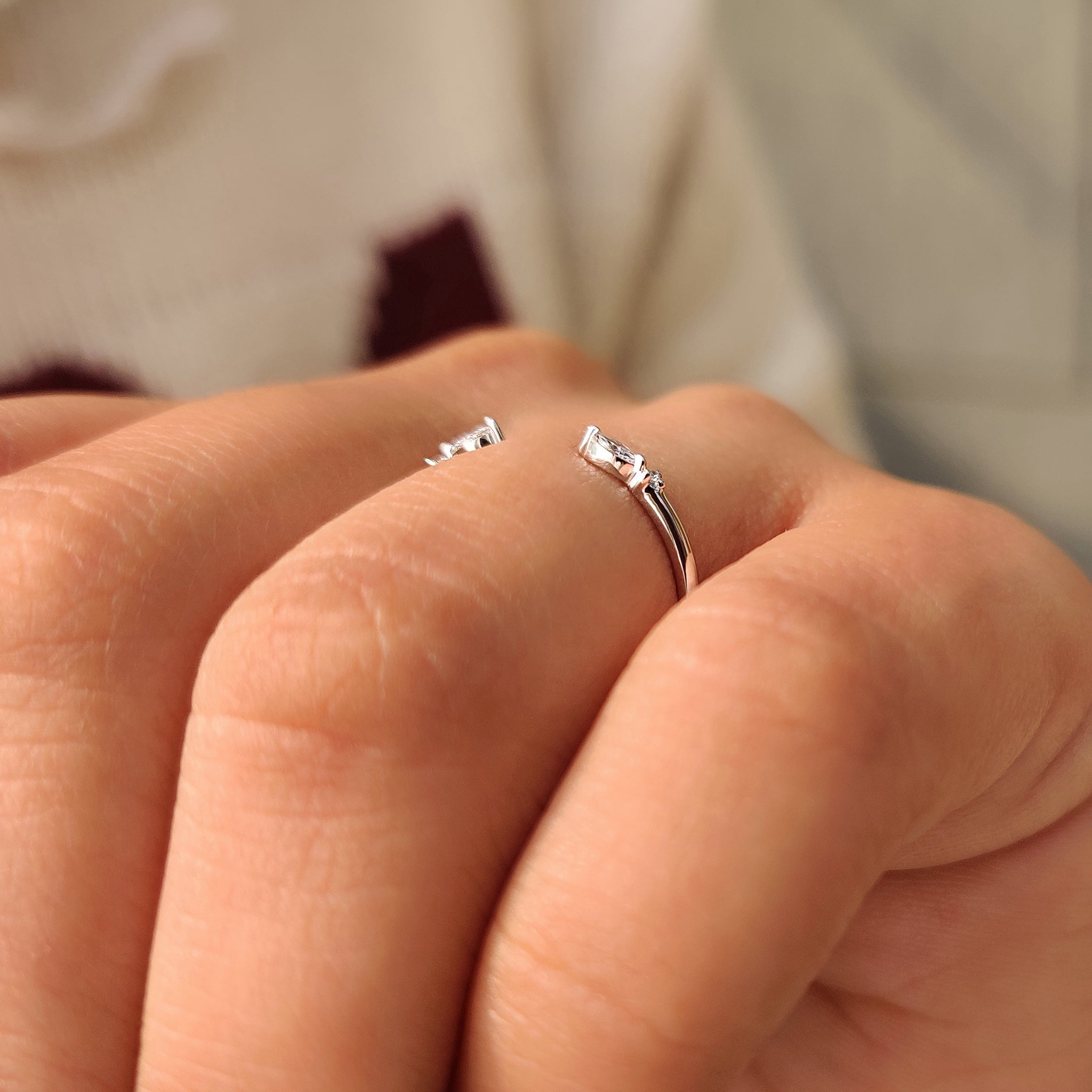 Shared prong setting marquise and round diamond band.
