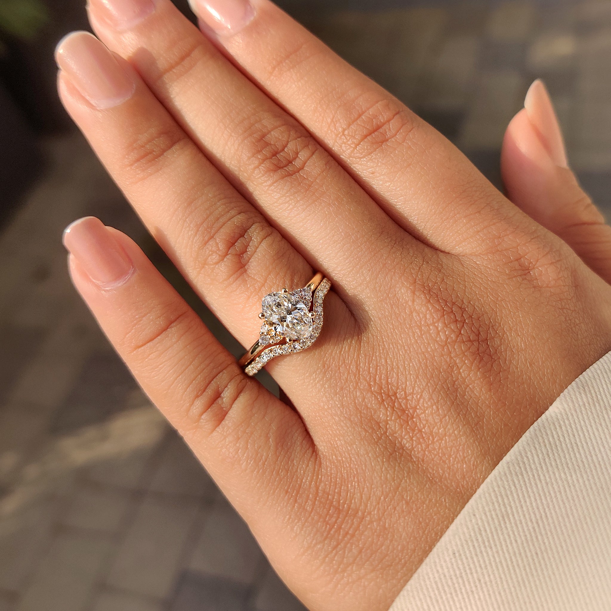 Lab grown oval diamond ring with matching wedding band.
