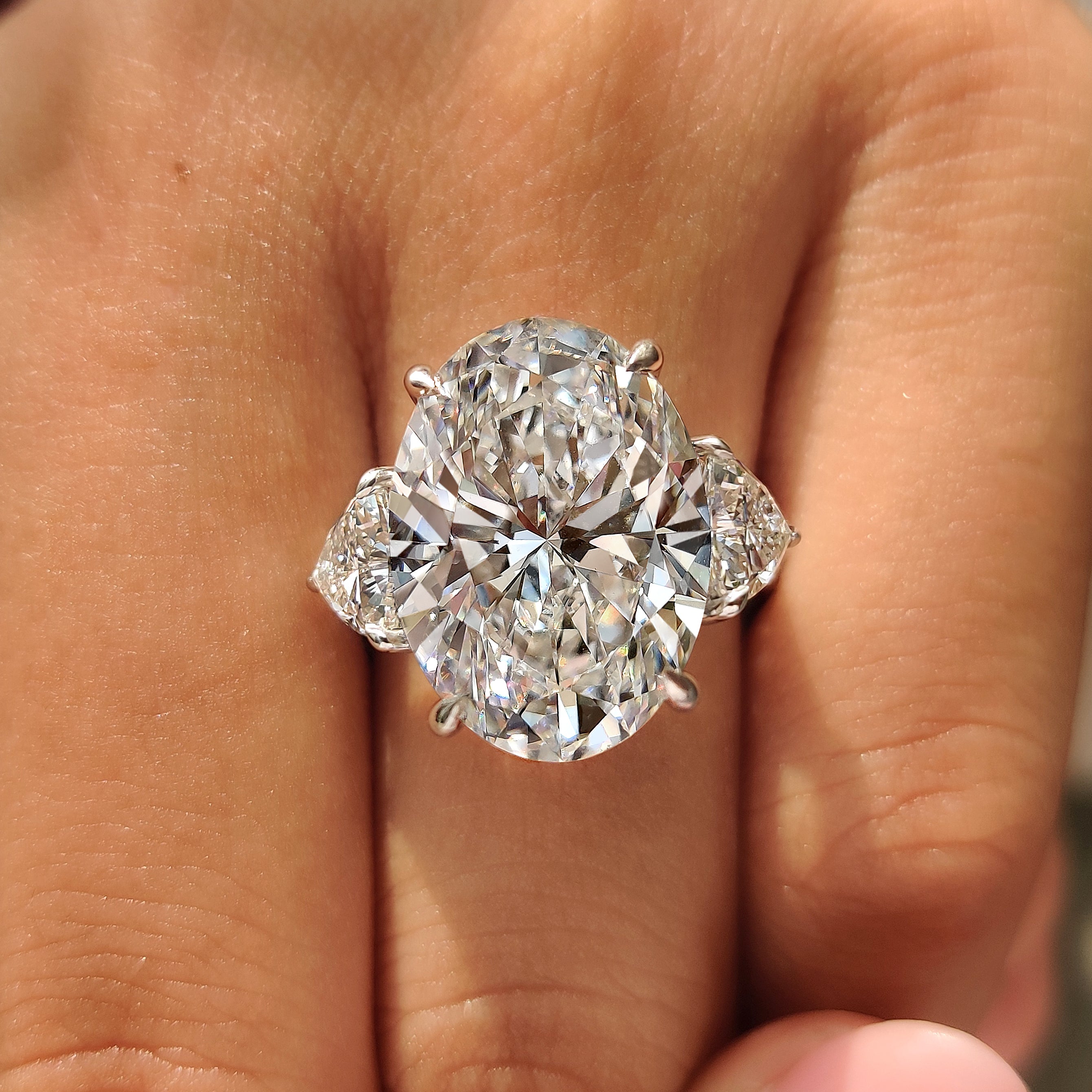 Oval diamond ring with four claw prong setting
