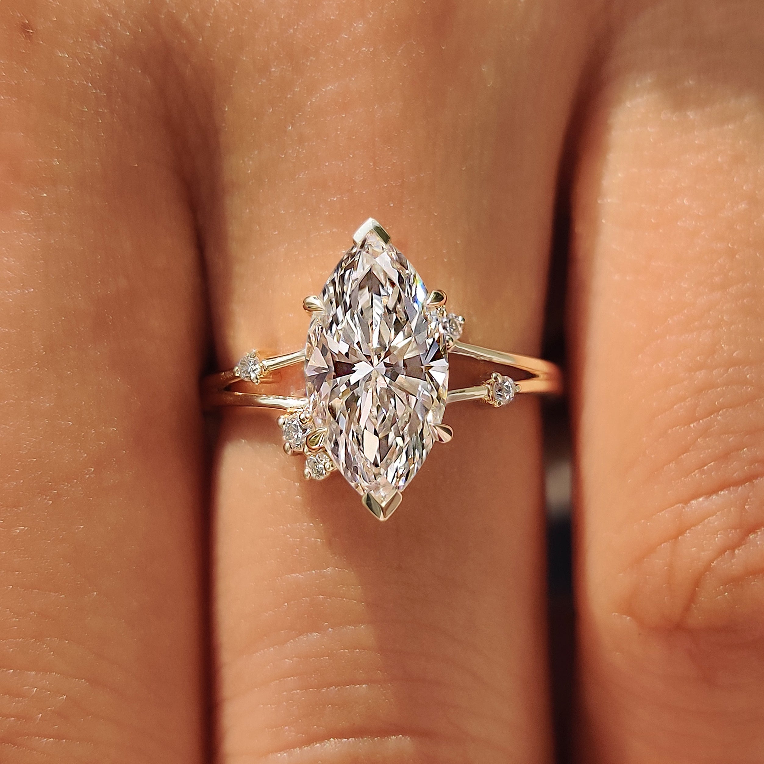Round diamond accents along the split shank design.
