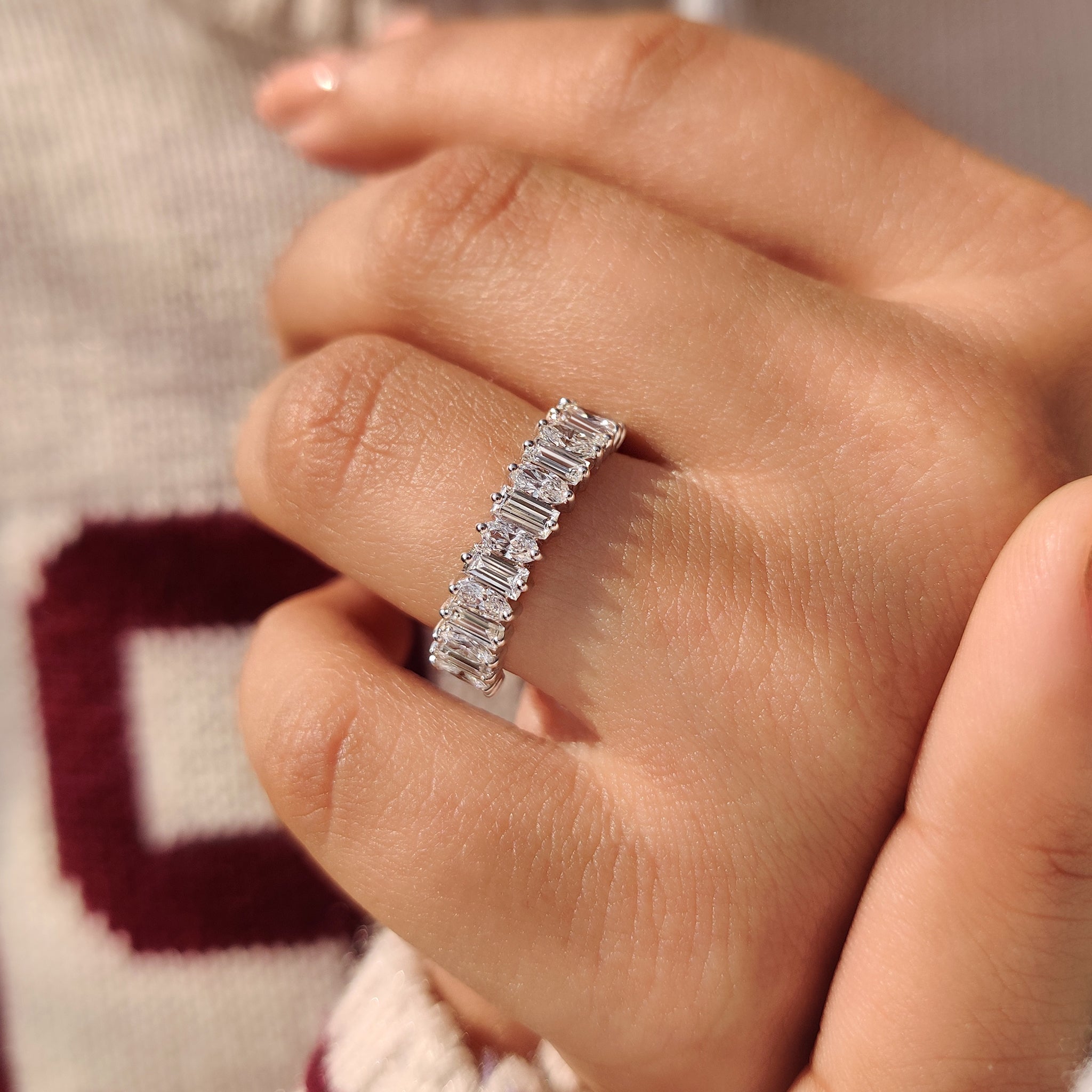 Half eternity band designed with tapered shank and diamond detail