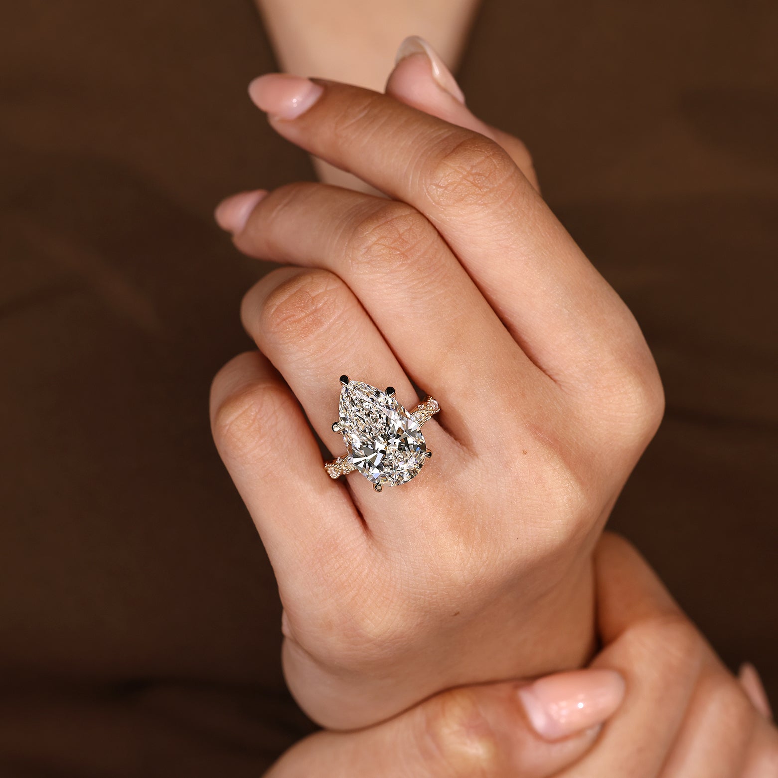 Lab grown diamond pear shaped ring with milgrain details
