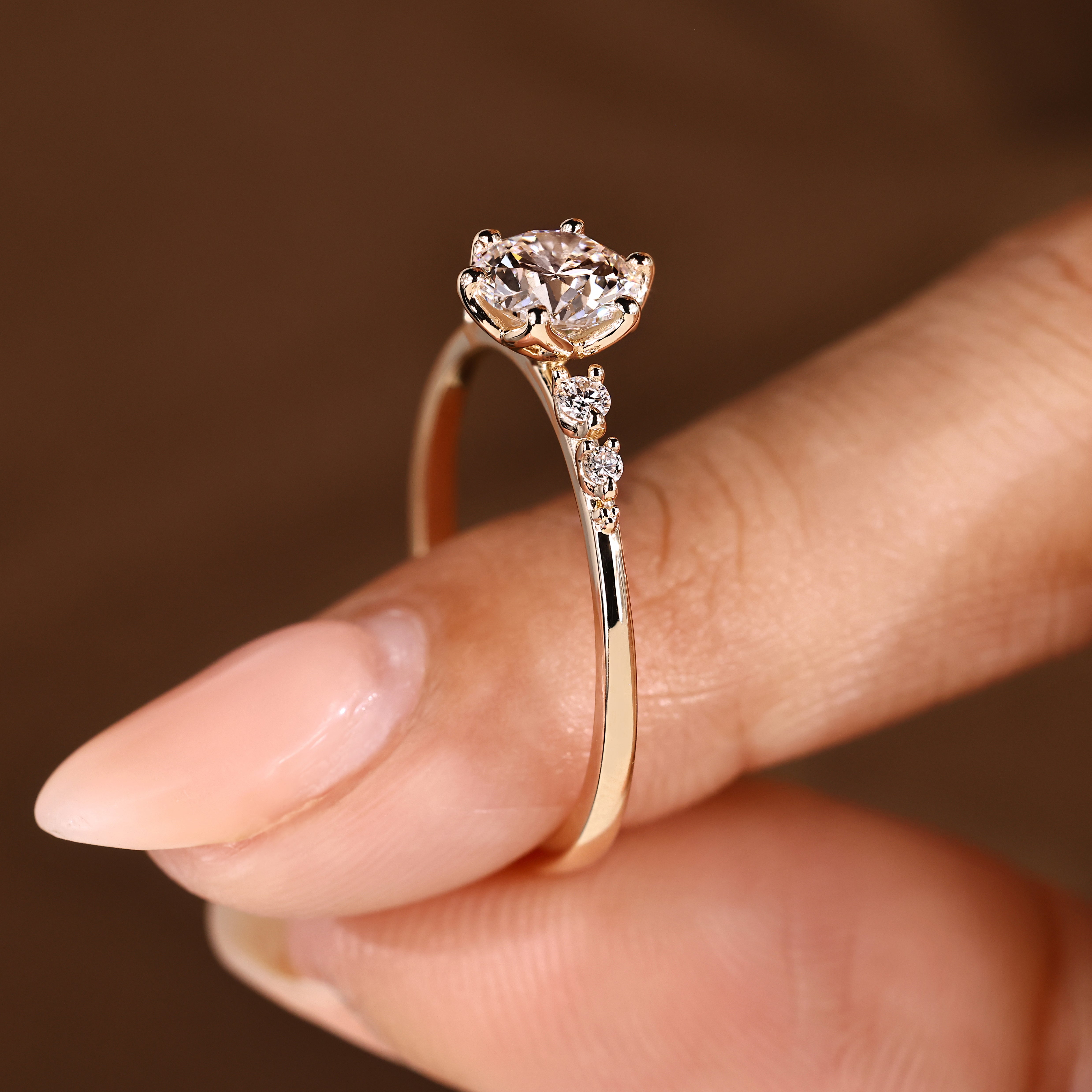 Lab grown diamond ring with round side stone details
