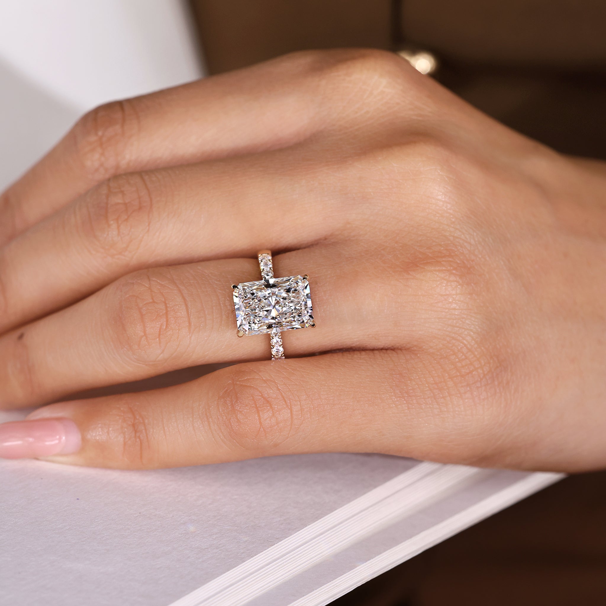 Handmade radiant diamond ring with round pave band
