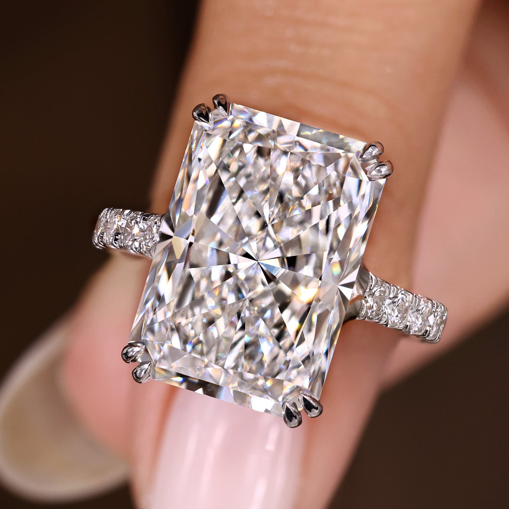 Radiant cut diamond ring with round diamond pave band
