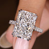 Radiant cut diamond ring with round diamond pave band
