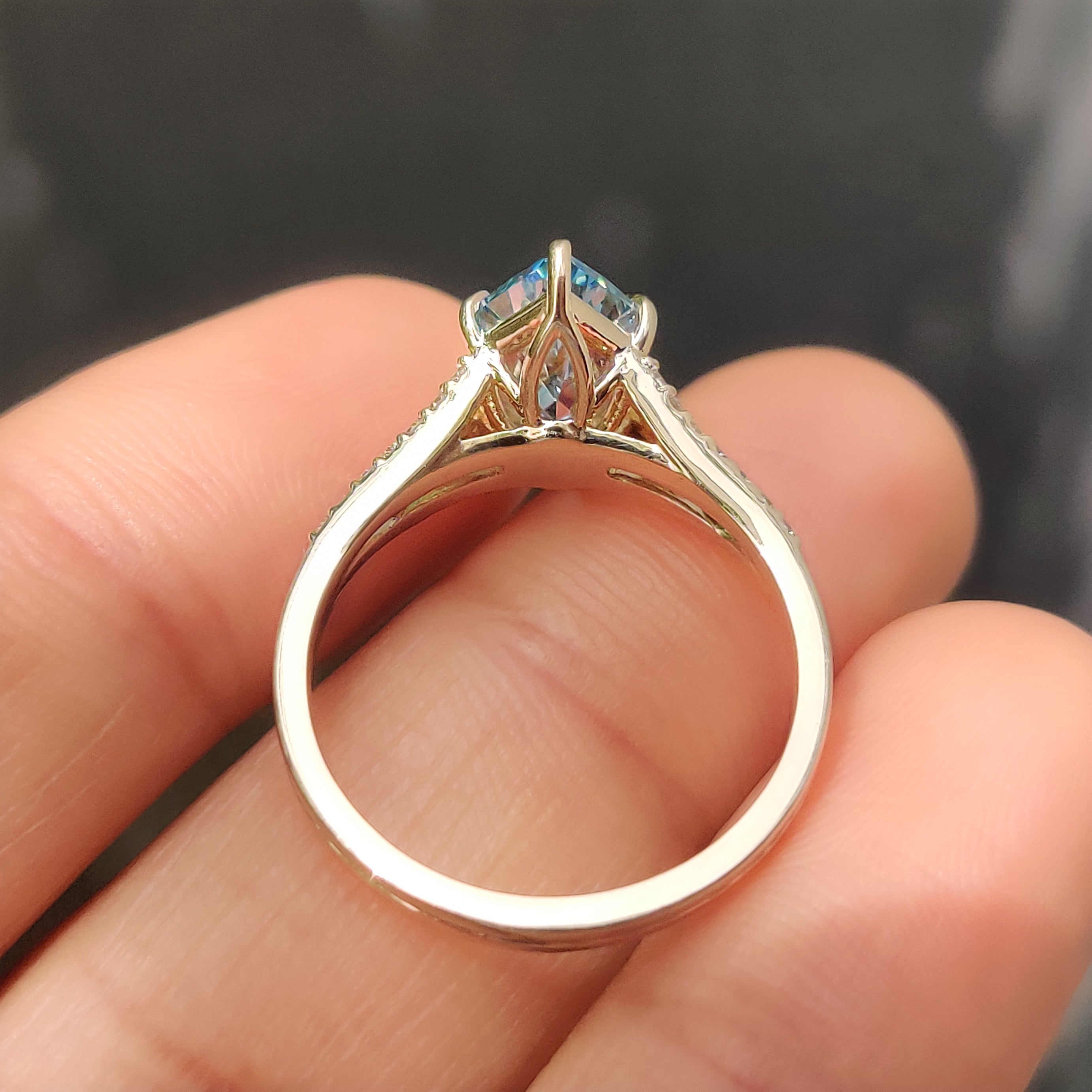 Handmade marquise diamond ring with blue center stone
