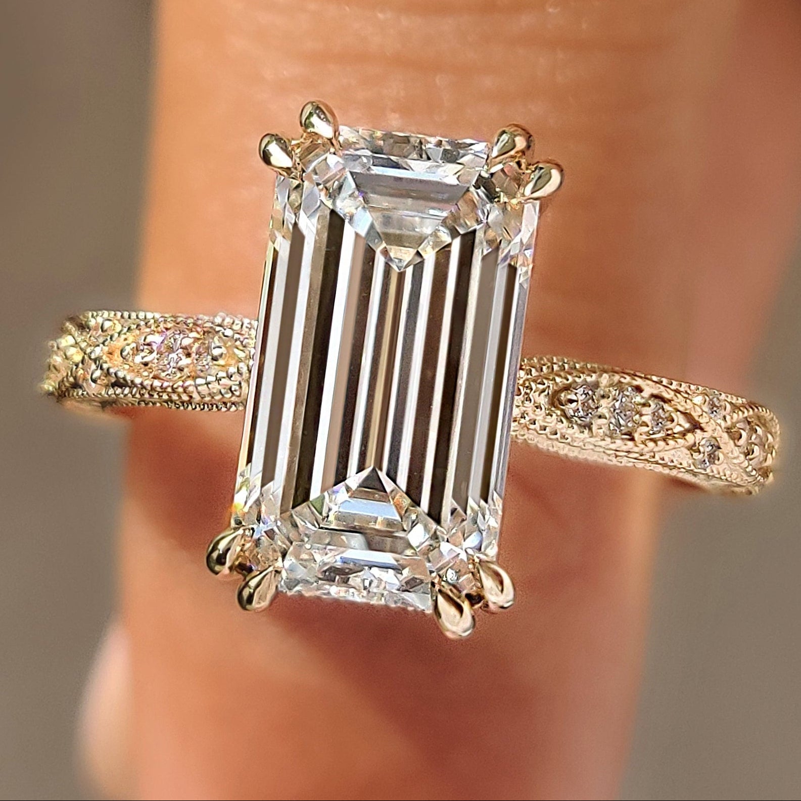Vintage emerald ring with round hidden halo.
