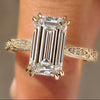 Vintage emerald ring with round hidden halo.
