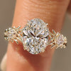 Oval three stone ring with kite side stones
