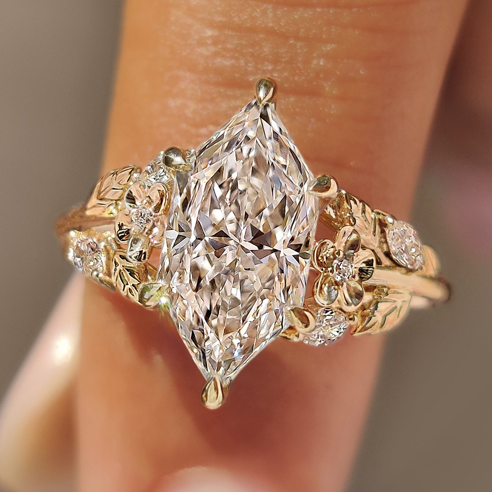 Nature inspired engagement ring with Dutch marquise center diamond.
