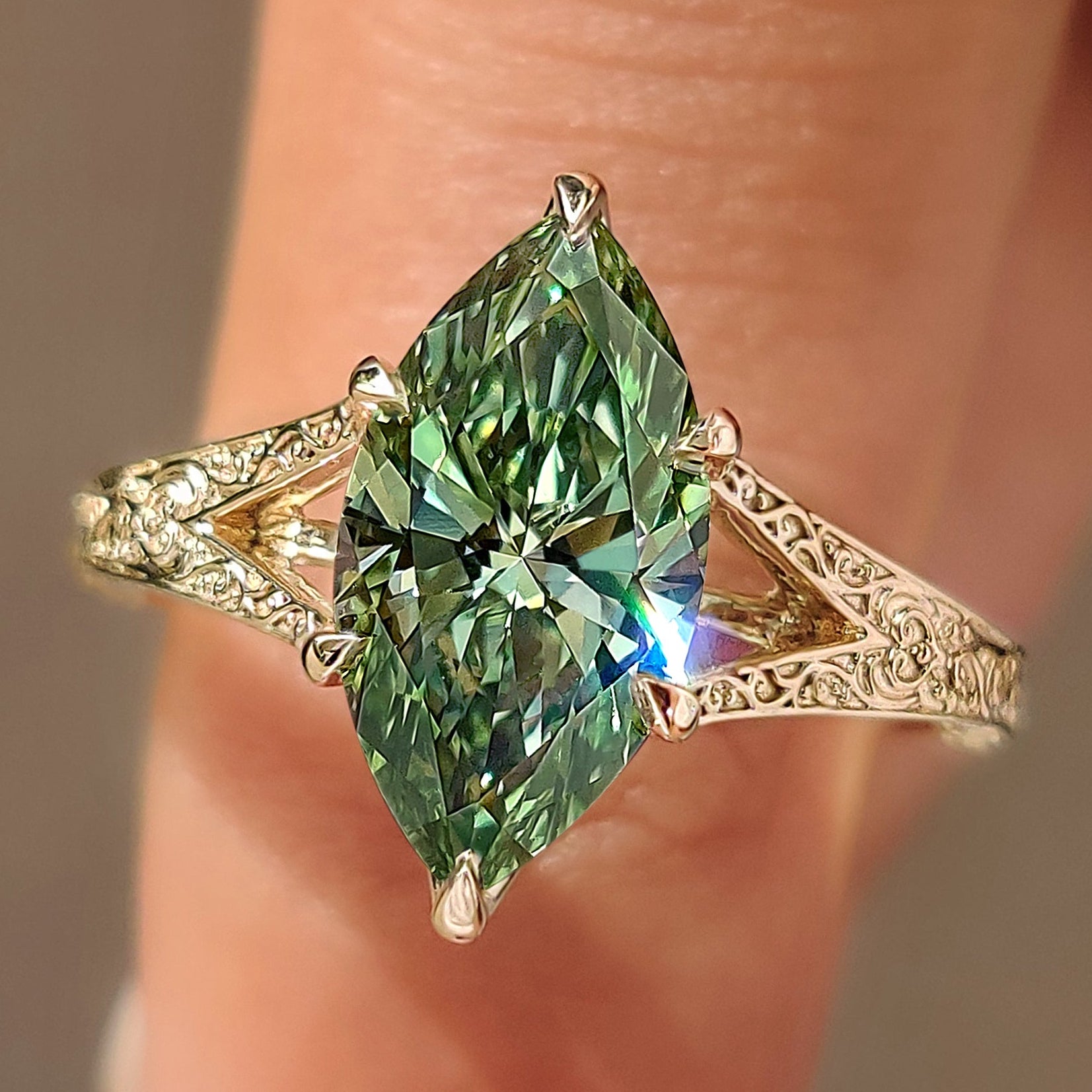 Green marquise diamond solitaire ring with tulip setting