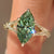 Green marquise diamond solitaire ring with tulip setting