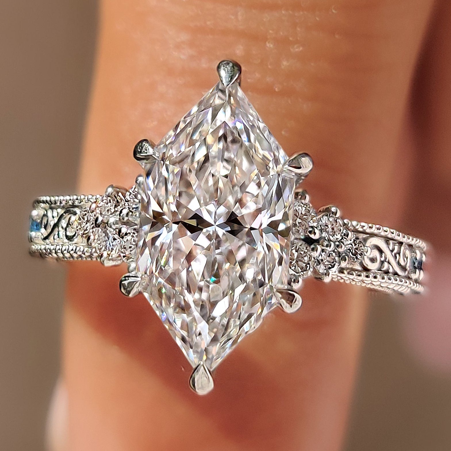 Dutch marquise engagement ring with round side stones.

