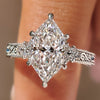 Dutch marquise engagement ring with round side stones.
