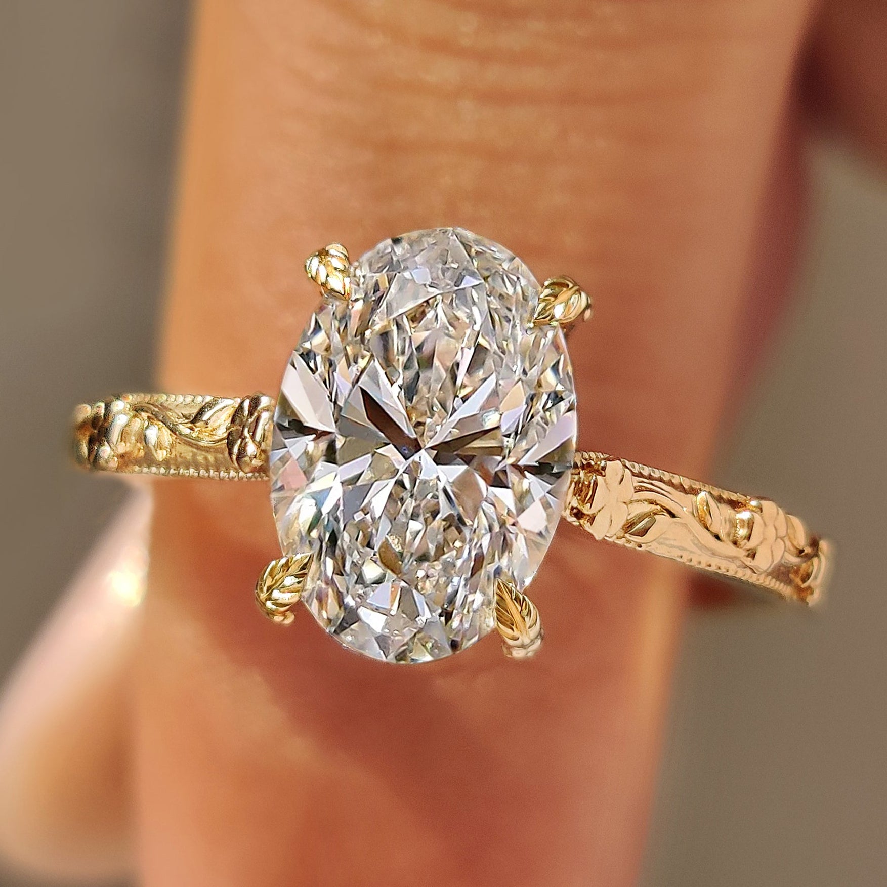 Oval diamond hidden halo engagement ring in solitaire style.

