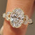 Oval ring with marquise and round diamond muse setting

