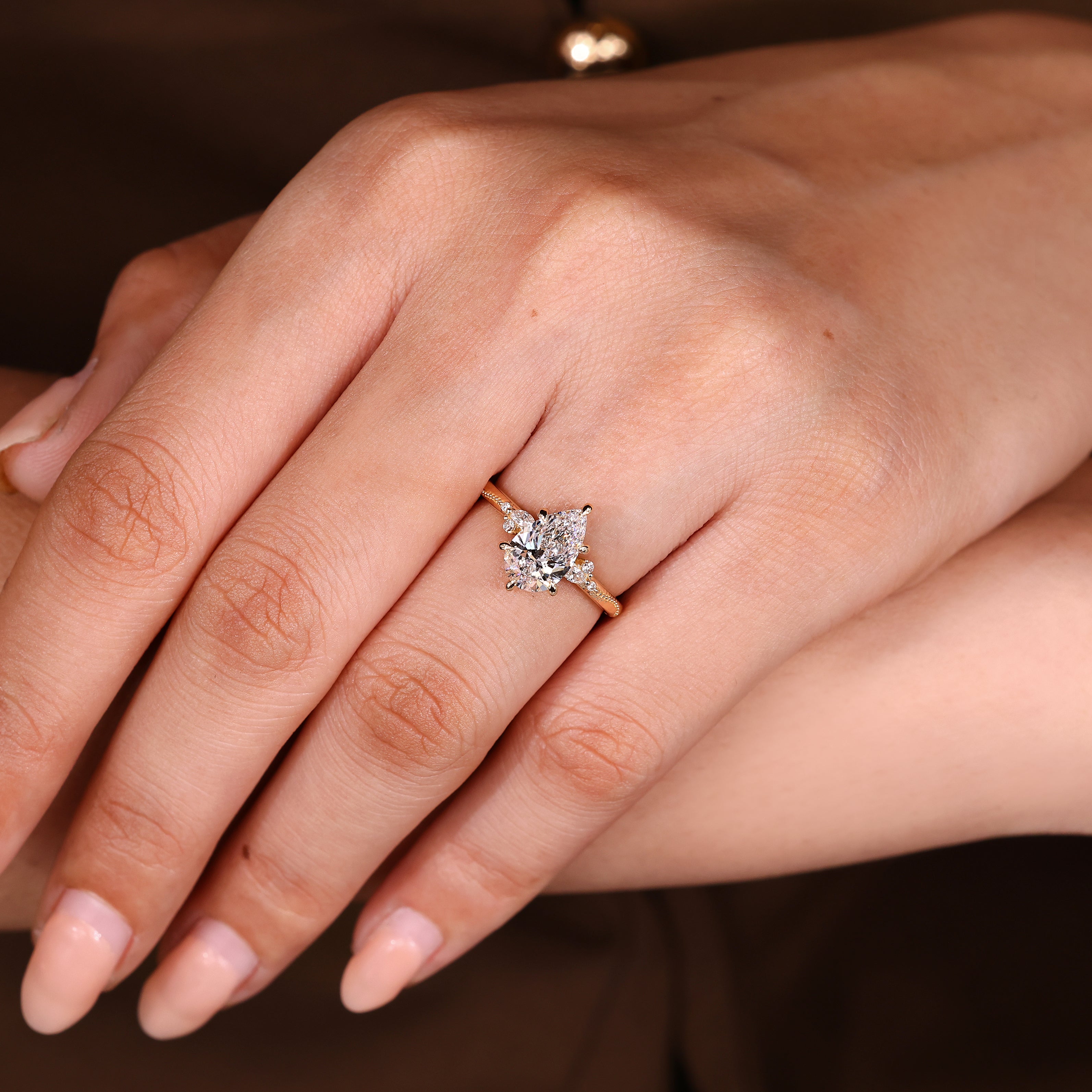 Handmade pear diamond ring with milgrain edge details
