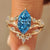 Blue Dutch marquise ring with wedding band in nature inspired style.
