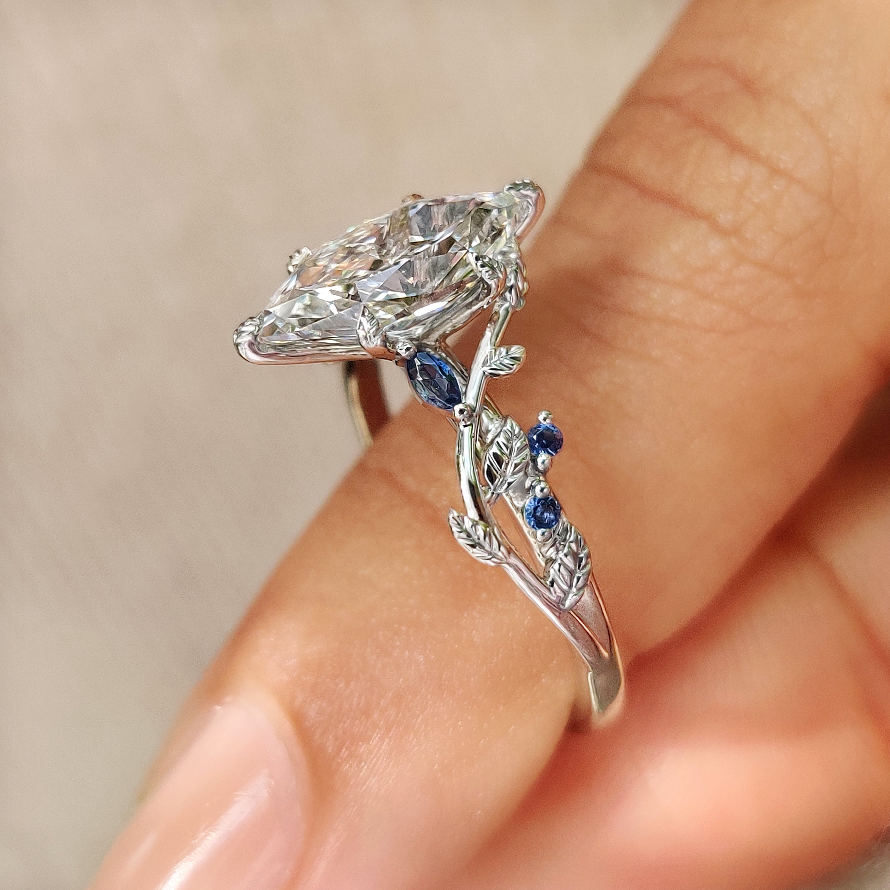 Dutch marquise ring with blue sapphire side stones
