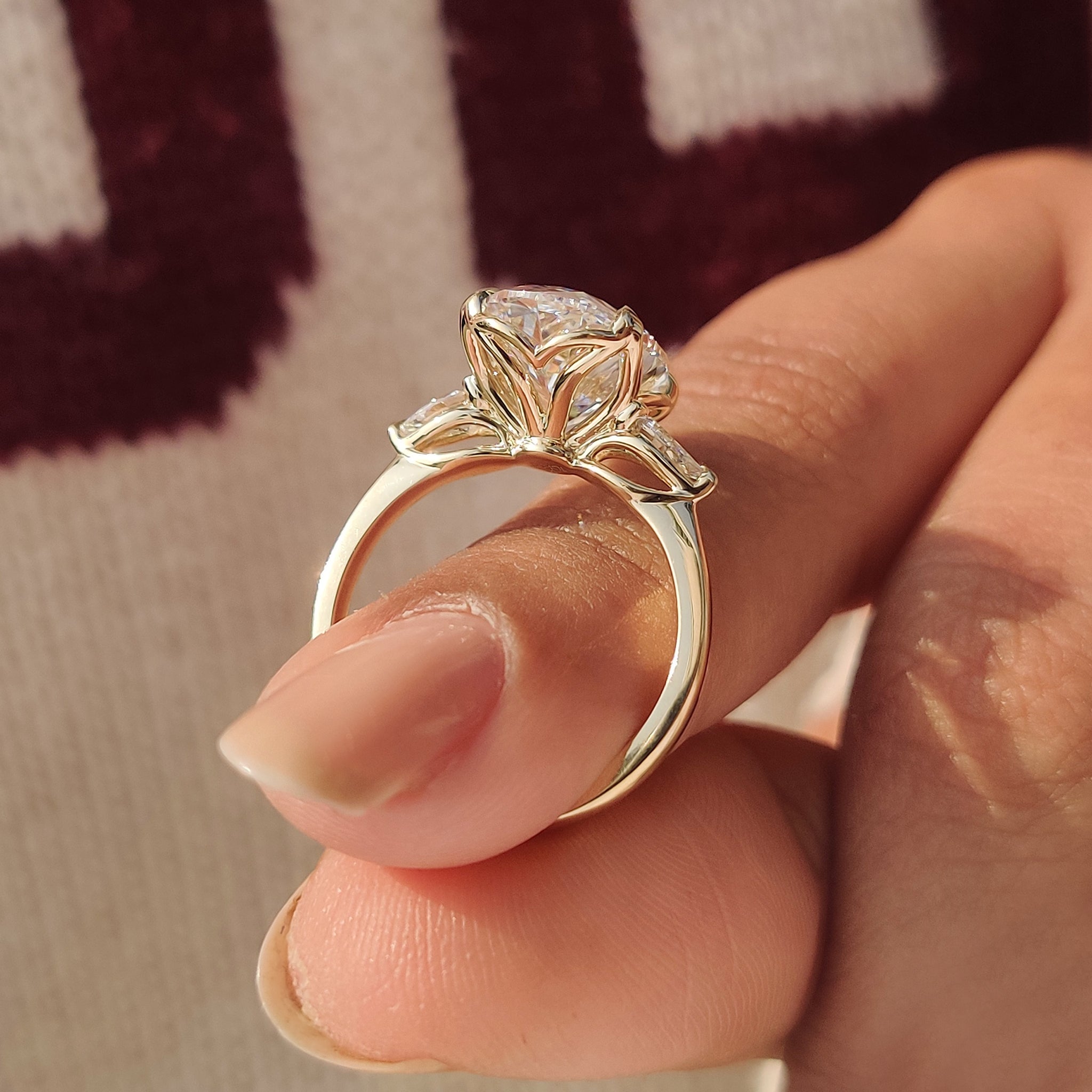 Three stone ring with oval center and pear accents
