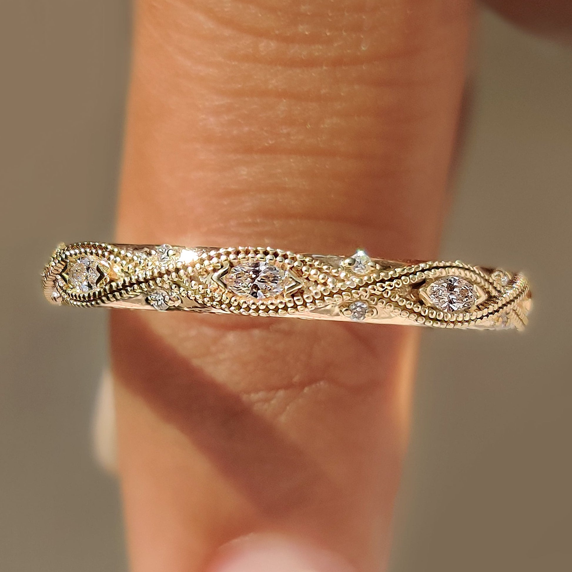 Milgrain wedding band with marquise and round diamonds.
