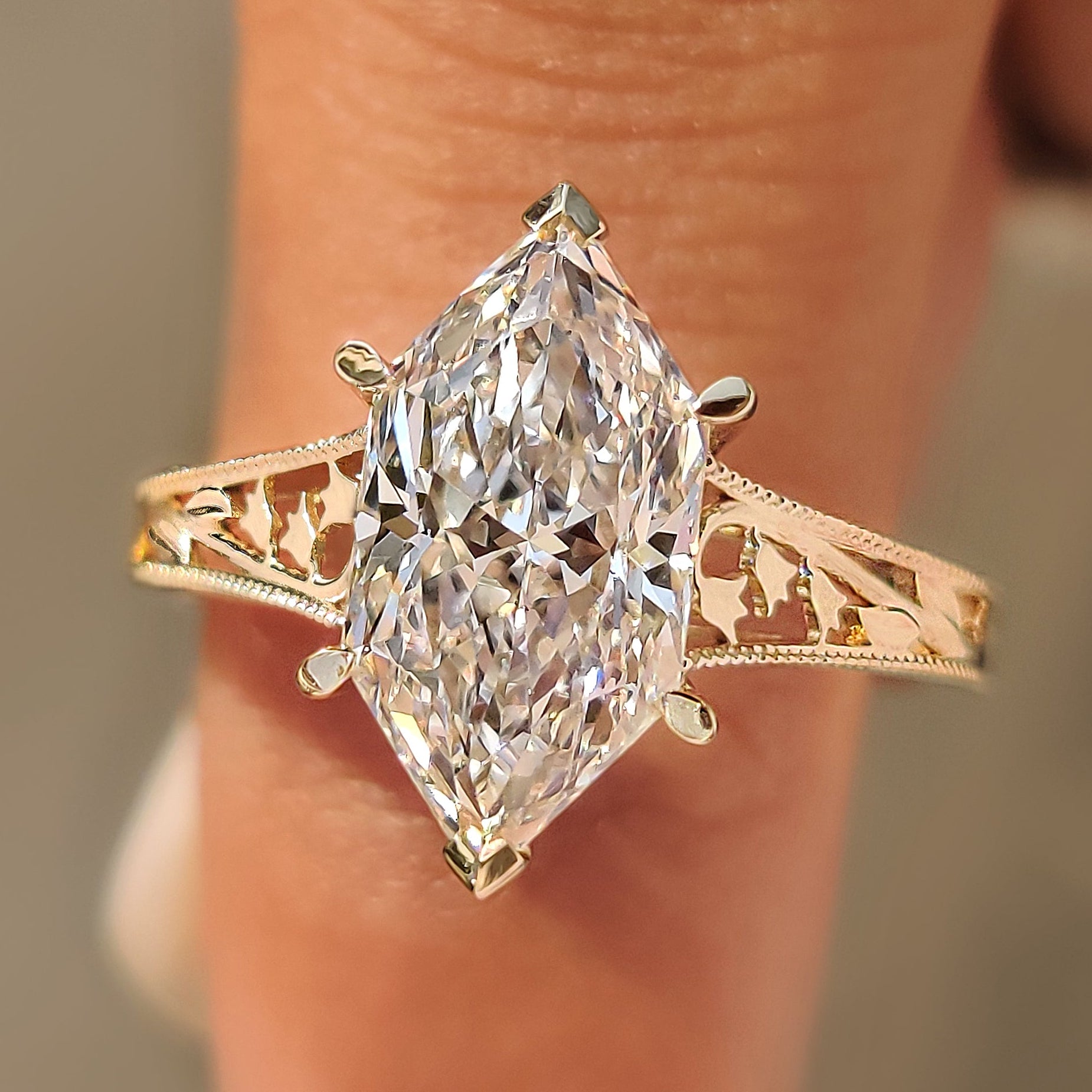 Dutch marquise solitaire ring with lily of the valley flower details.
