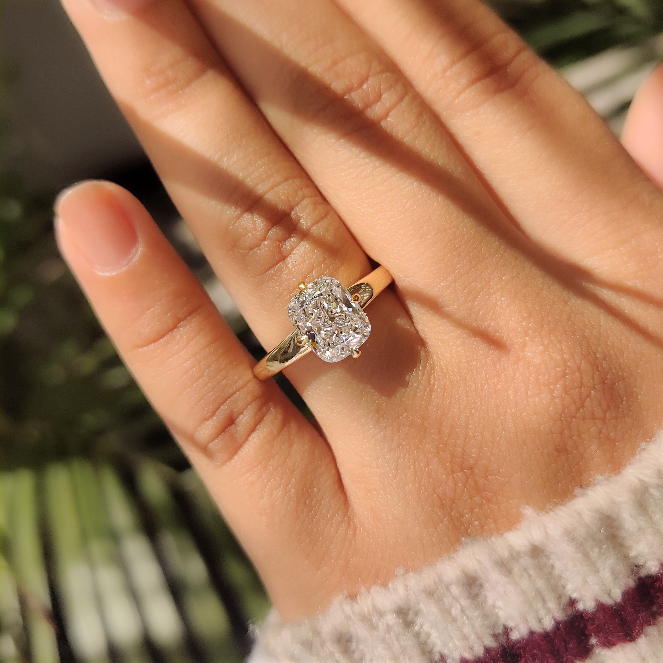 Cushion cut engagement ring with compass prong setting
