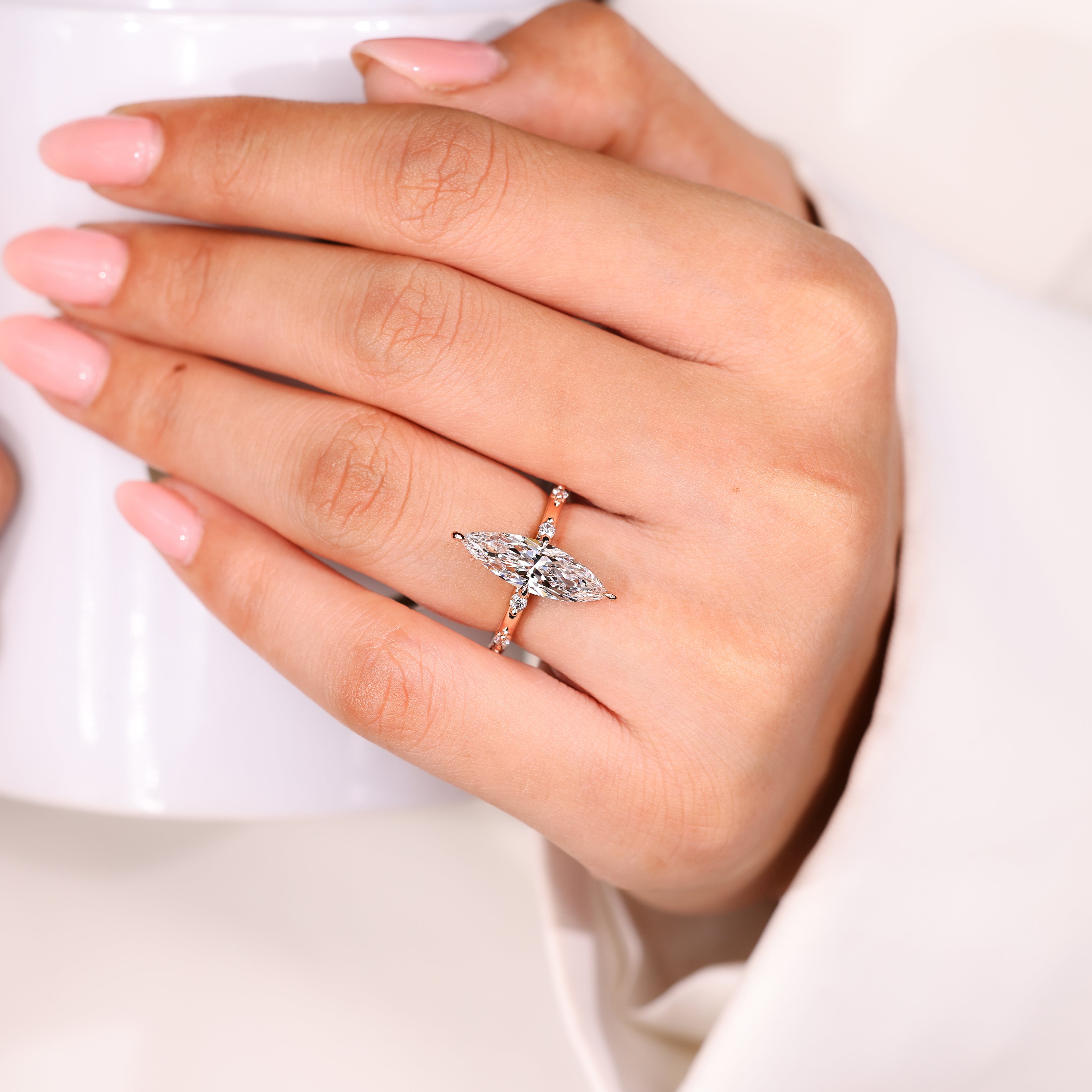 Handmade marquise diamond ring with seven stone arrangement
