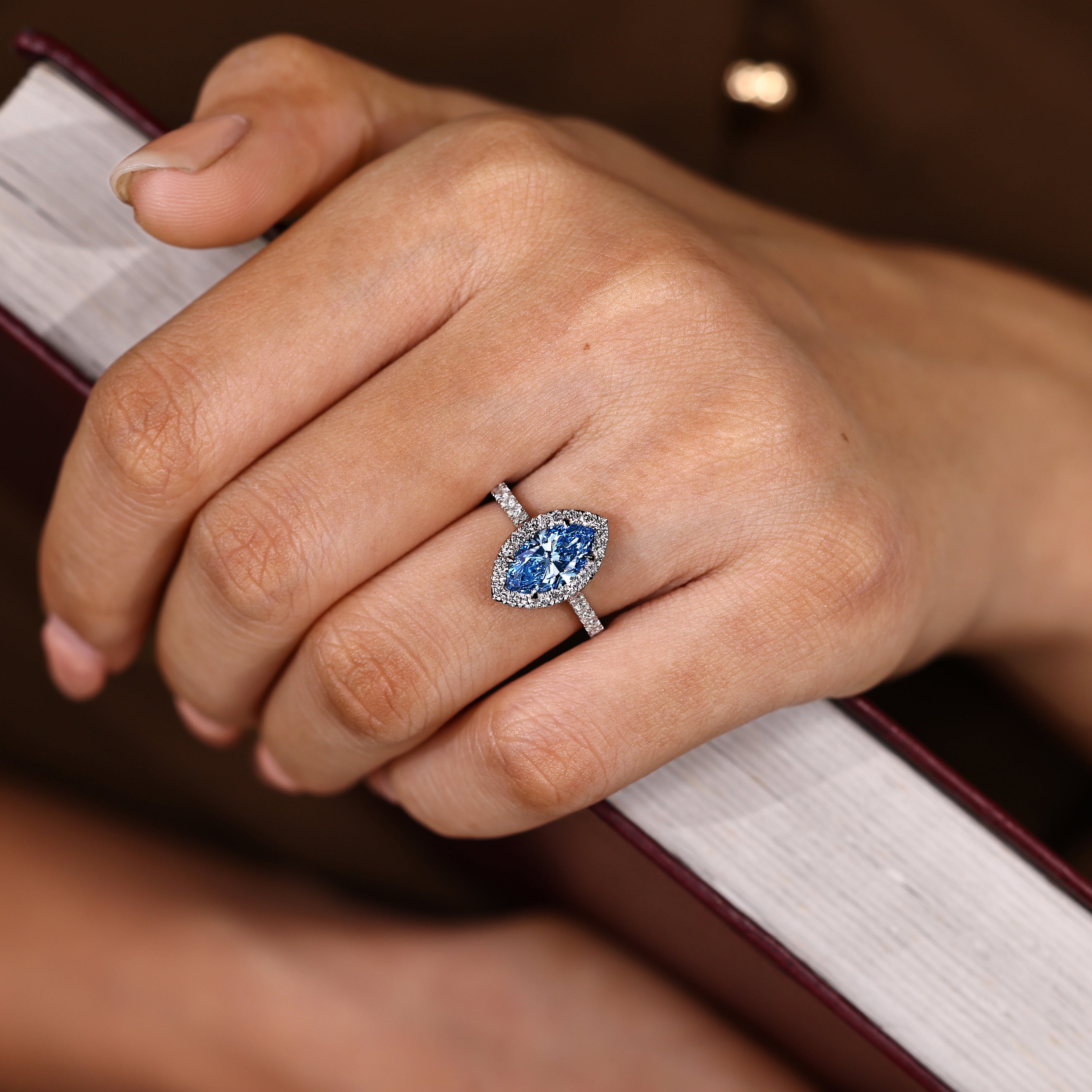 Marquise diamond ring with four claw prong setting style
