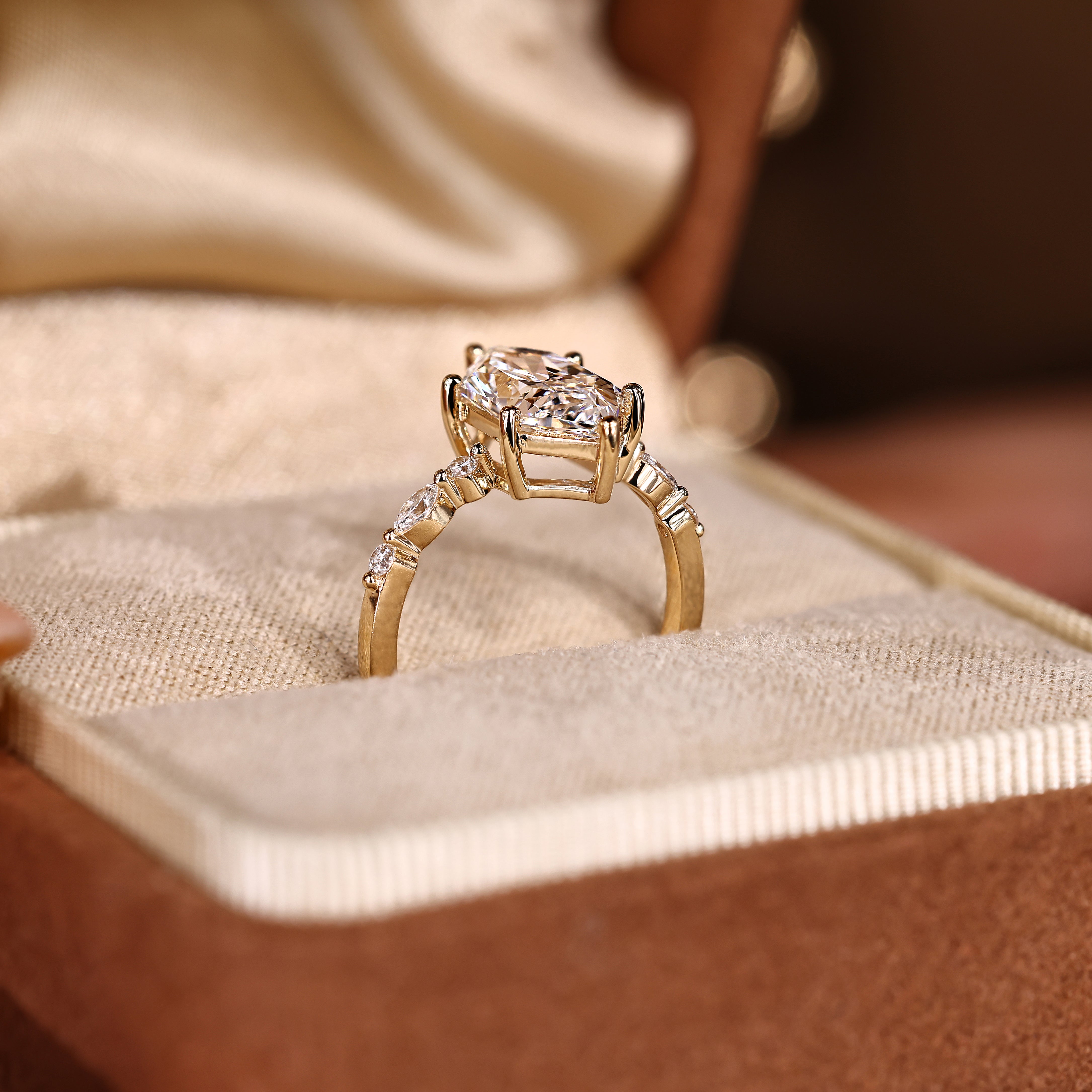 Carat Diamond marquise ring with round side stone accents
