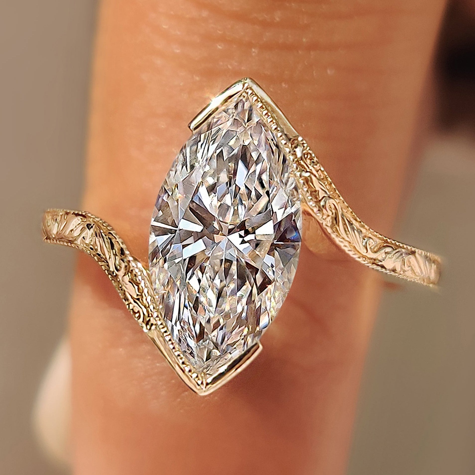 Marquise solitaire ring with vintage inspired bypass setting.
