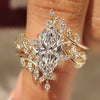 Marquise engagement ring set with nature inspired wedding band
