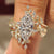 Marquise engagement ring set with nature inspired wedding band
