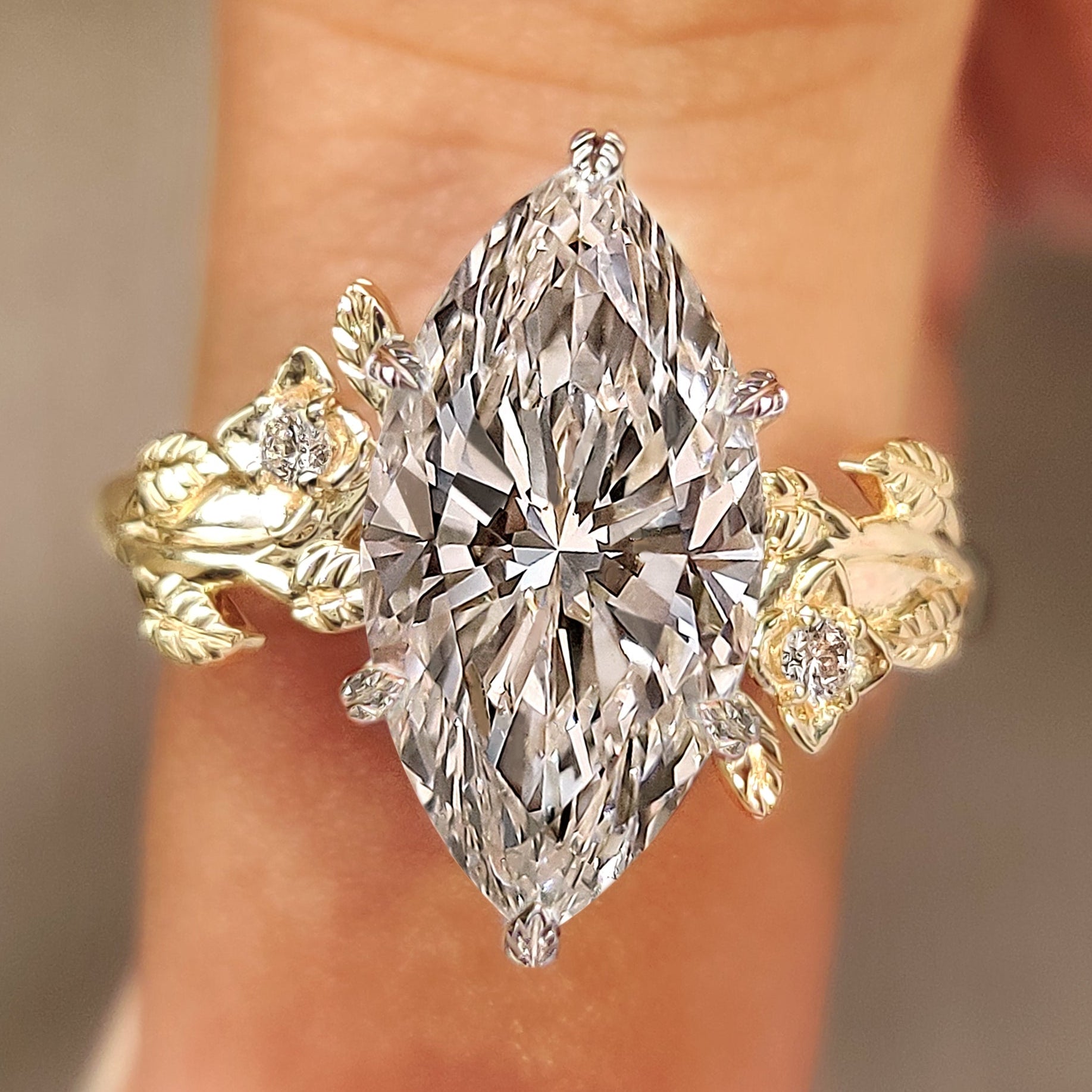 Nature inspired engagement ring with marquise center diamond
