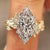 Nature inspired engagement ring with marquise center diamond
