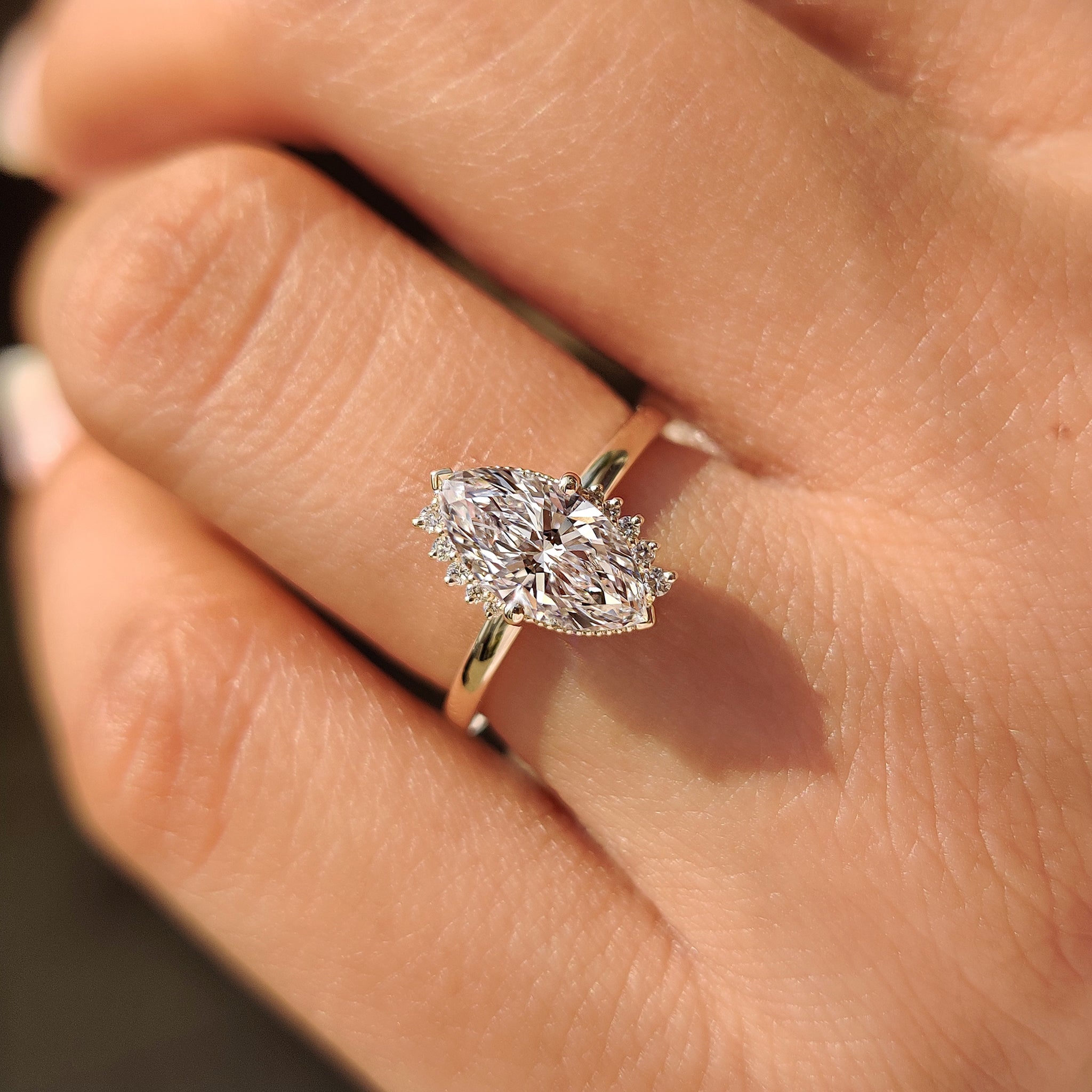 Compass prong marquise diamond ring design.
