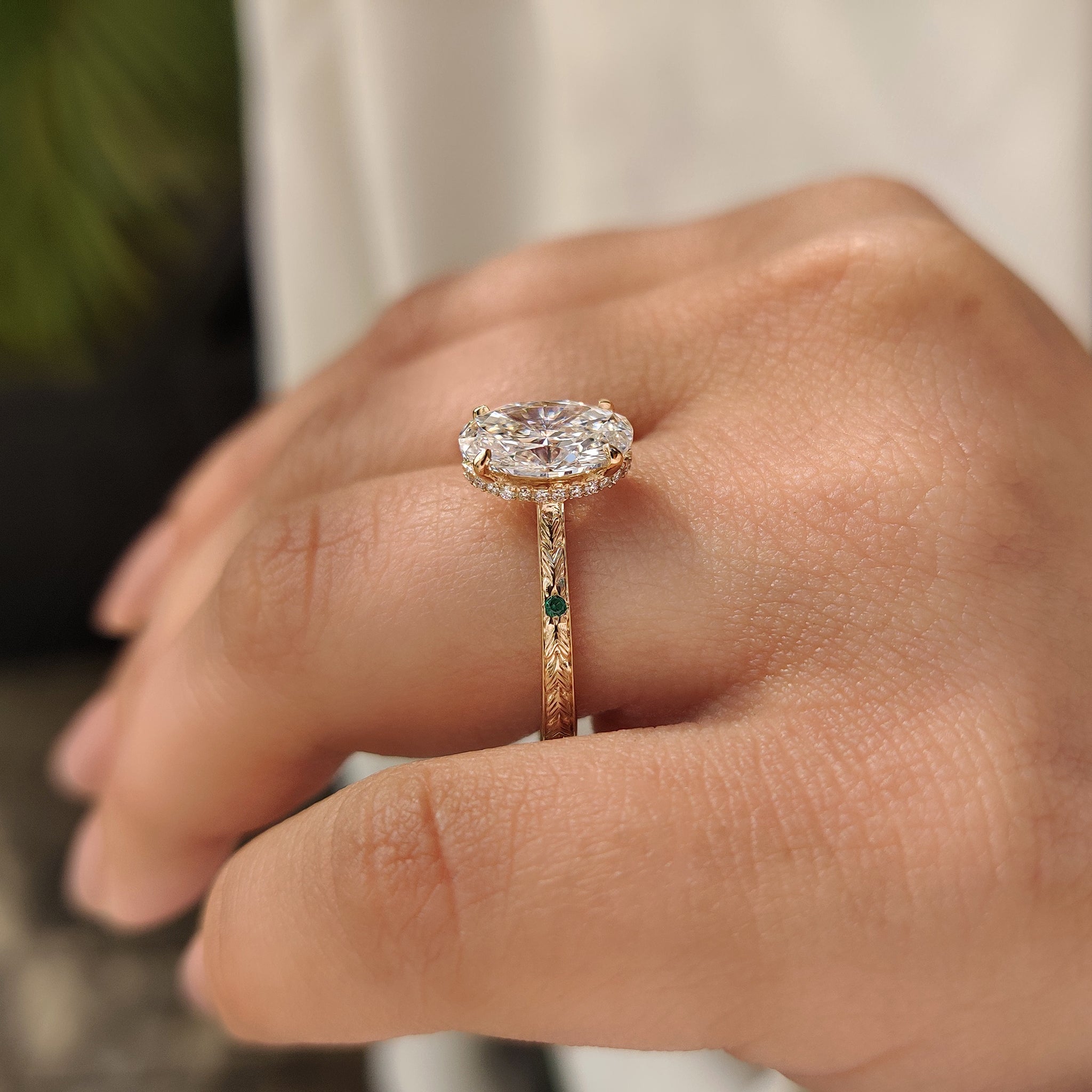 Oval cut lab grown diamond ring with four claw prong setting.
