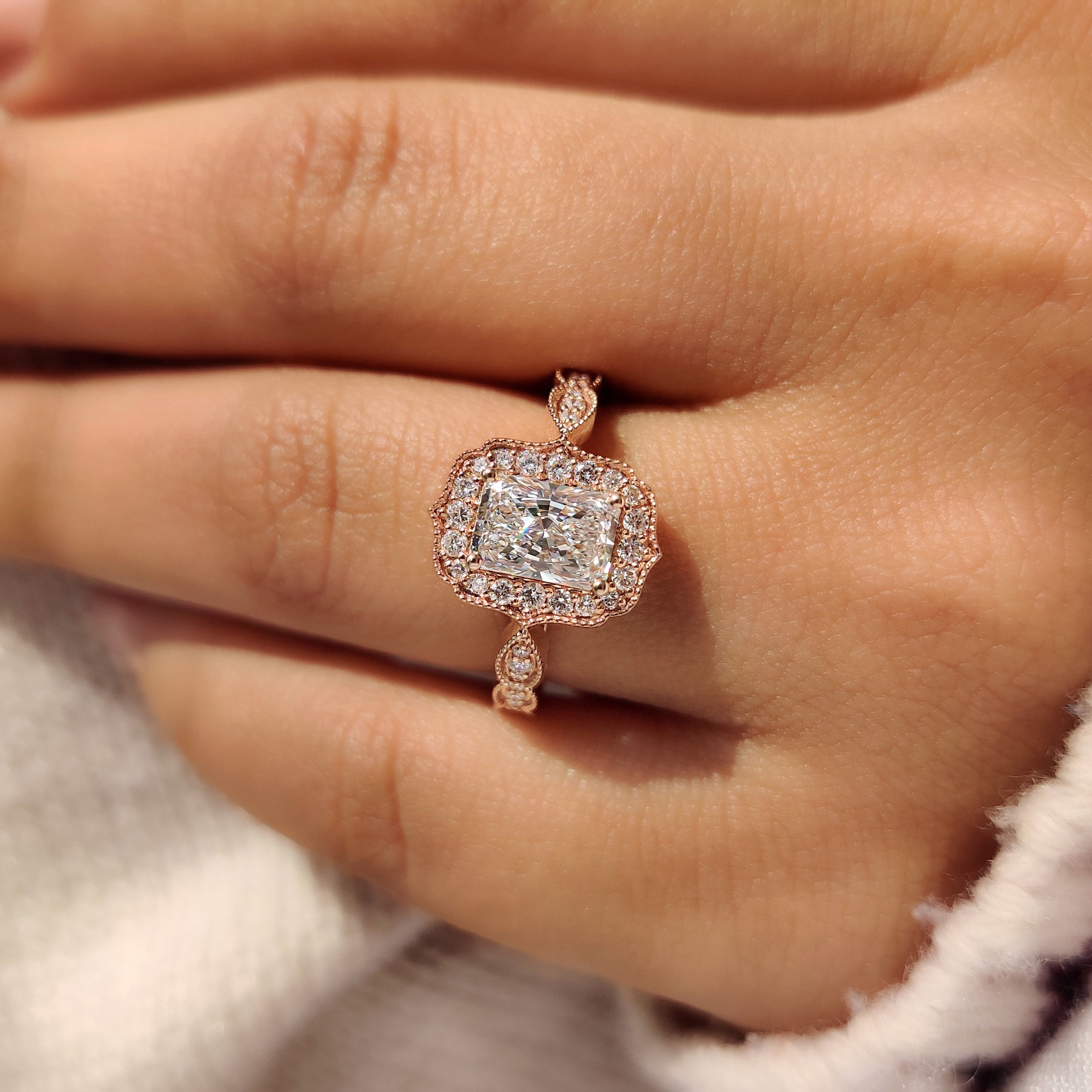 Radiant diamond ring with handcrafted vintage style setting.
