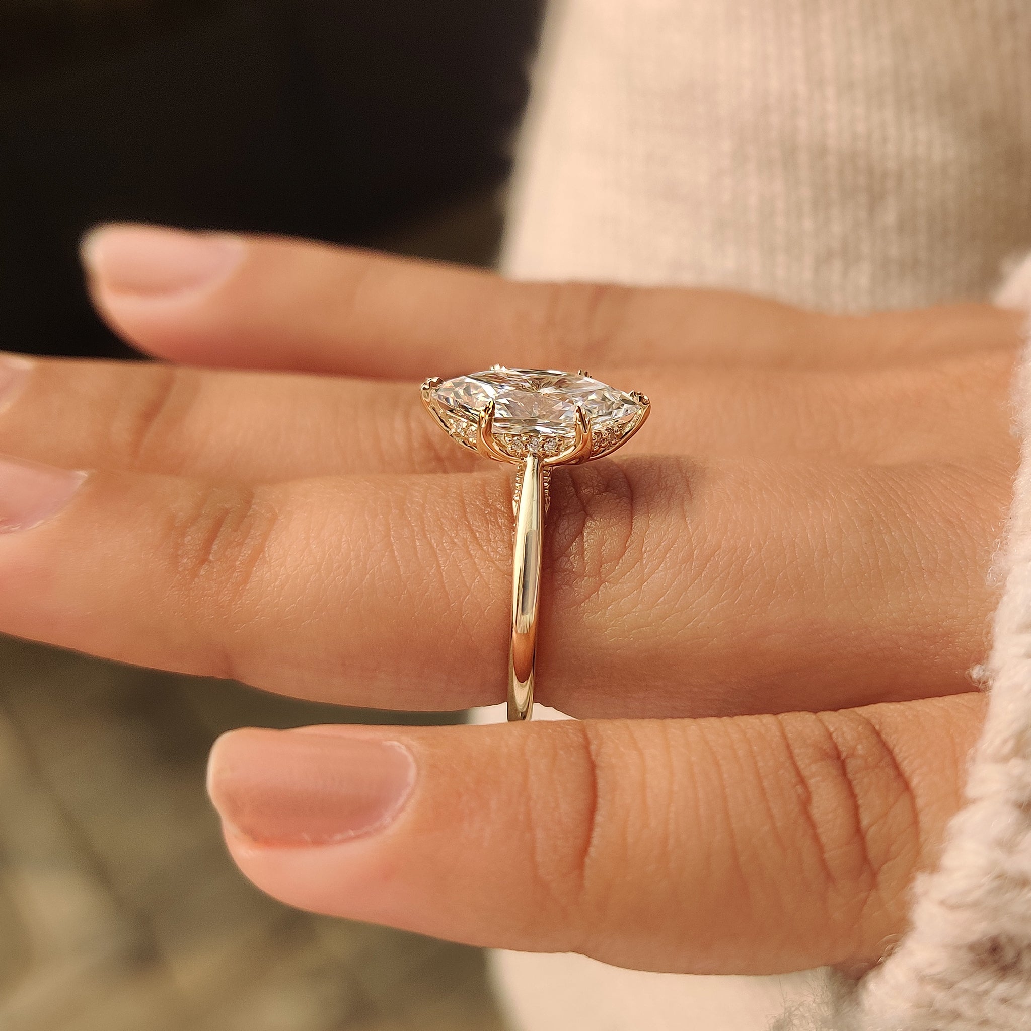 Dutch marquise ring with round cut hidden halo design.
