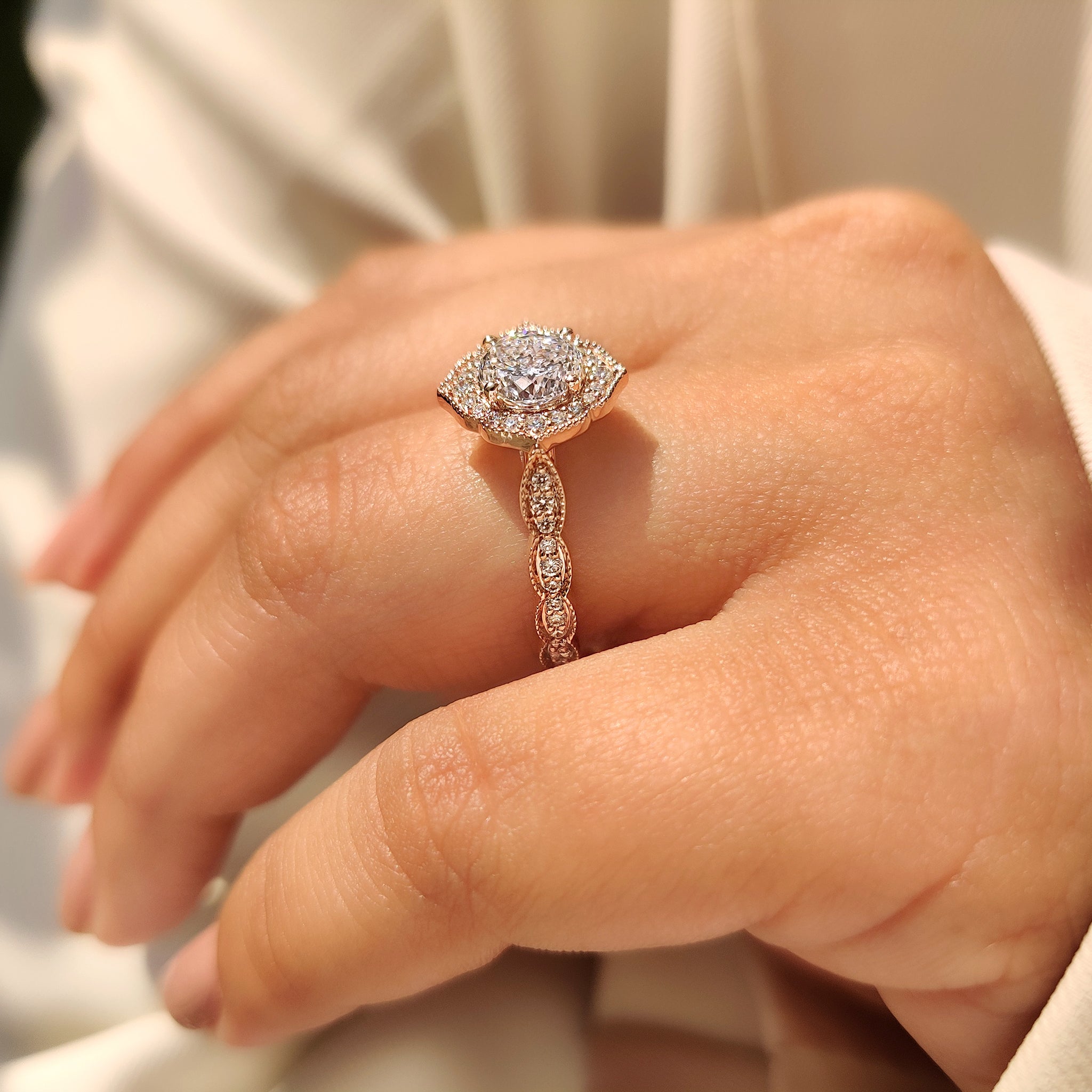 Vintage halo ring with Portuguese cut diamond and milgrain accents.
