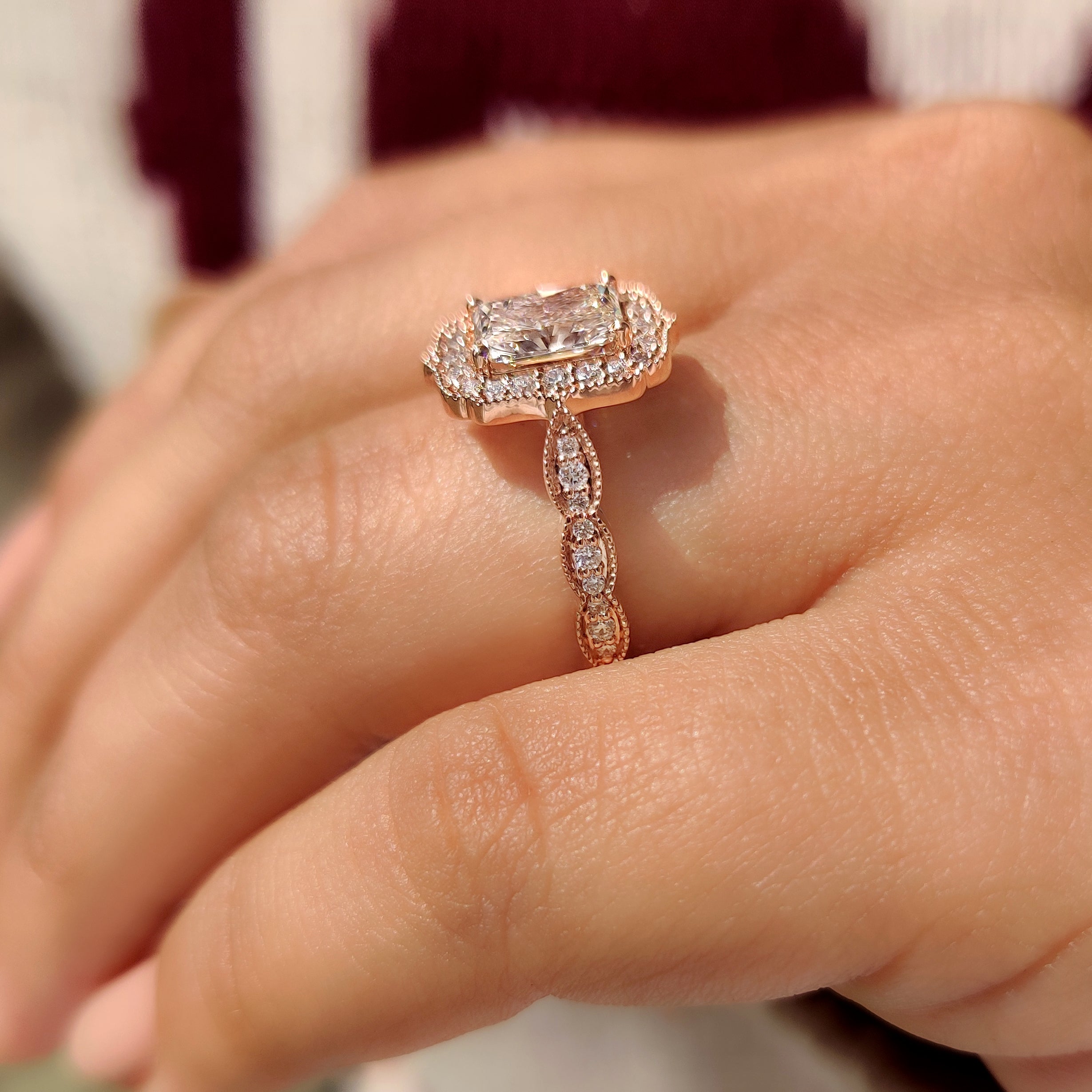 Handmade radiant cut ring with pave diamond band.
