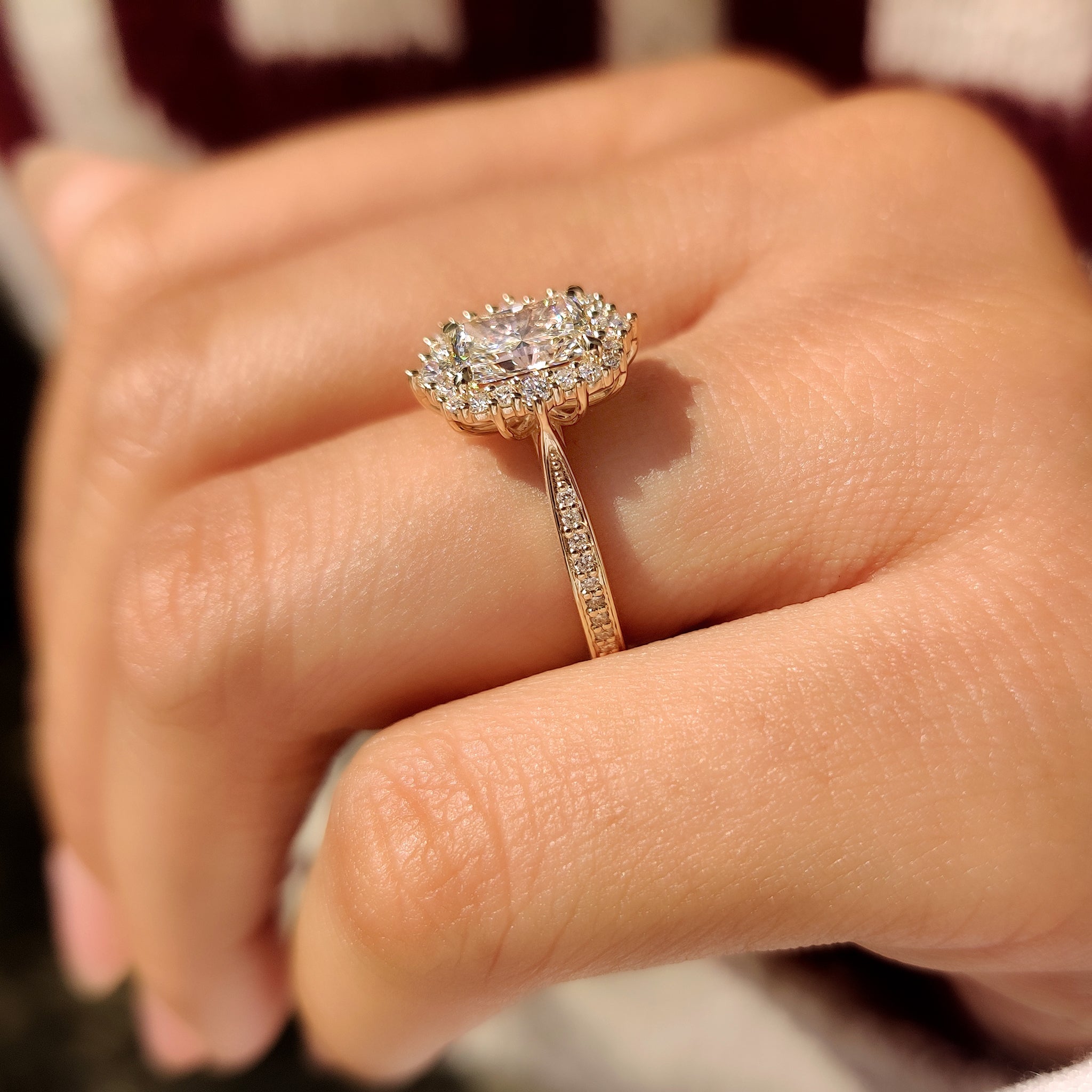 Radiant cut ring with vintage style and round halo.
