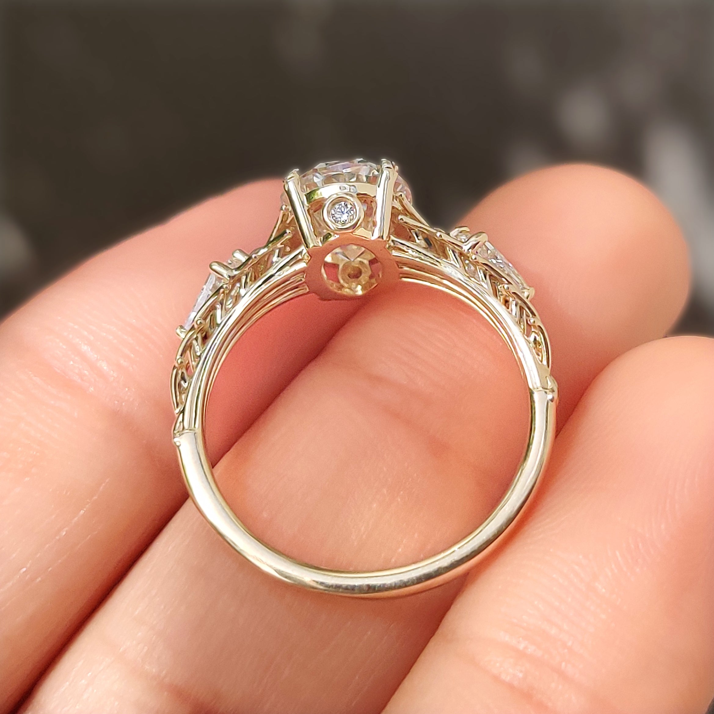 Basket setting three stone ring with kite diamonds