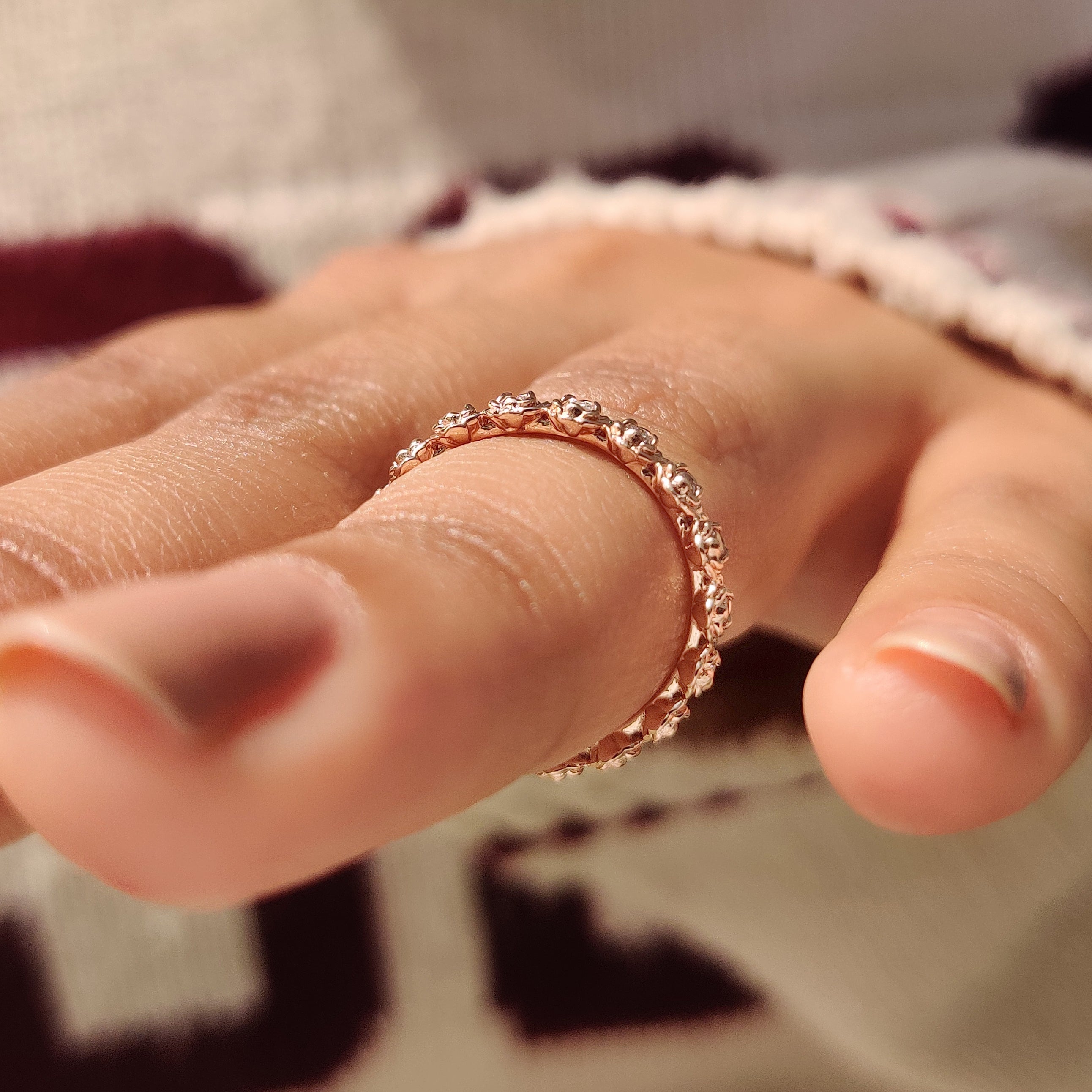 Nature inspired band with round diamond in flower design.
