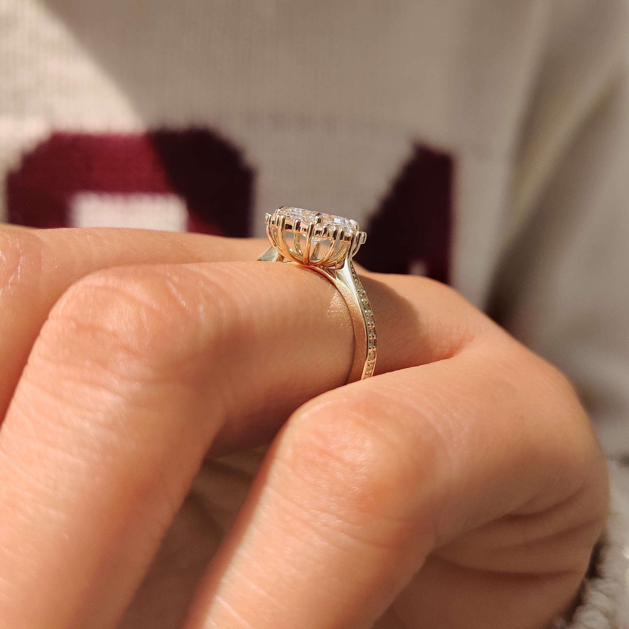 Radiant diamond ring with four prong and pave band.
