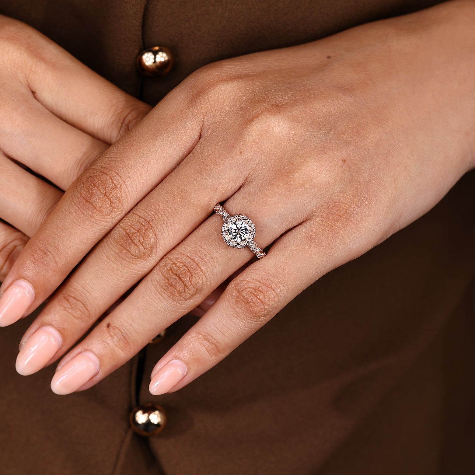 Round diamond ring with pave details and halo accents
