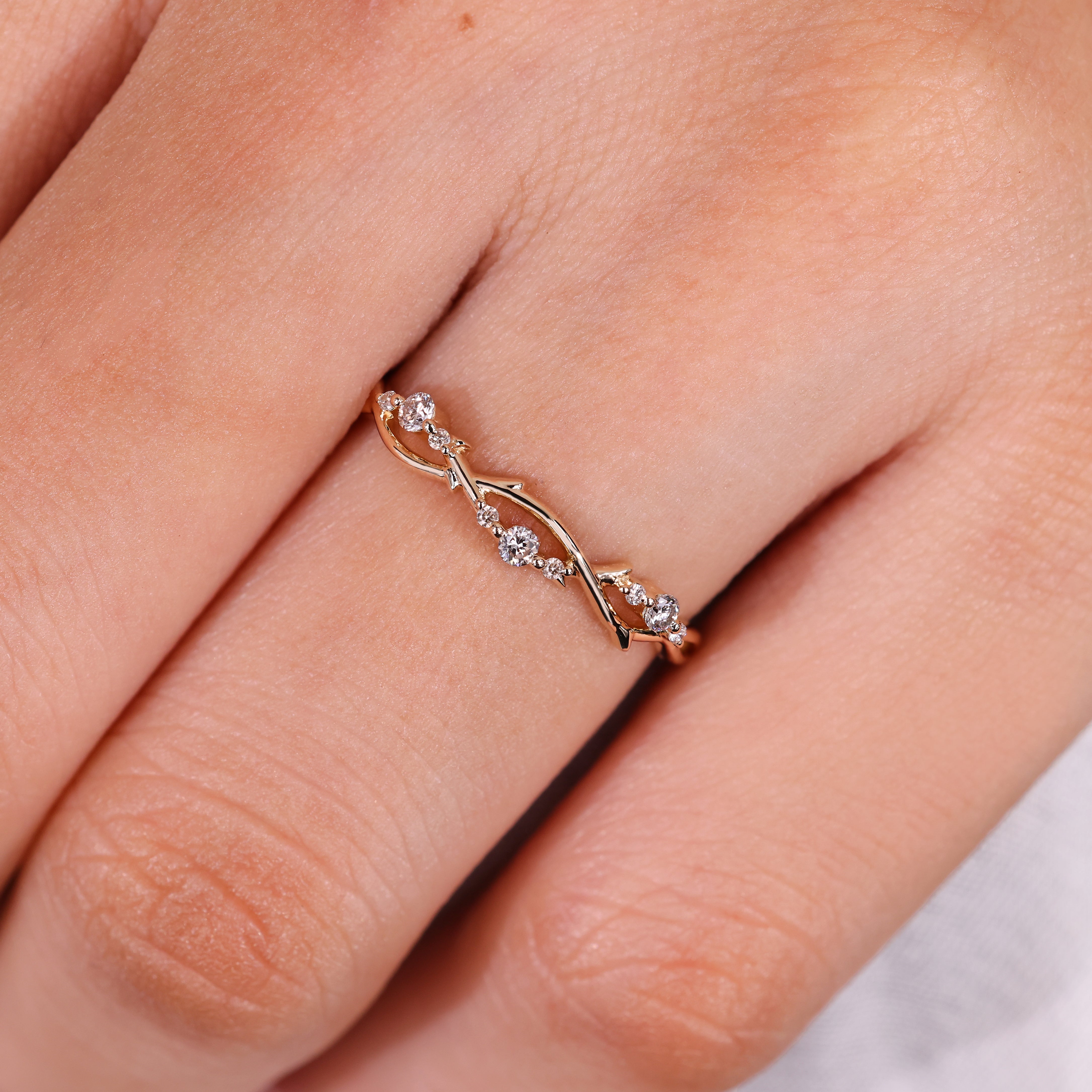 Vine design with round diamonds on wedding band
