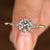 Round cut diamond ring with round side stones design
